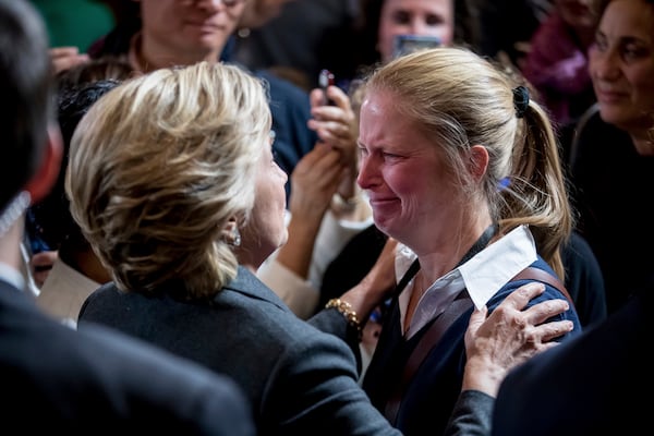 FILE - Democratic presidential candidate Hillary Clinton, left, greets a supporter after speaking at the New Yorker Hotel in New York, Nov. 9, 2016, where she conceded her defeat to Republican Donald Trump after the hard-fought presidential election. (AP Photo/Andrew Harnik, File)