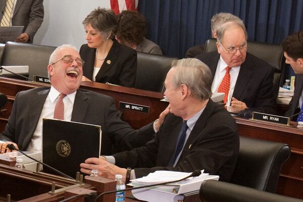 FILE - House Budget Committee member, Rep. Gerald Connolly, D-Va., foreground, left, has a laugh with fellow committee member Rep. Dennis Moore, D-Kan., on Capitol Hill in Washington, March 15, 2010. Connolly, a Democratic congressman and fixture of Virginia politics, has died at age 75. (AP Photo/Harry Hamburg, File)
