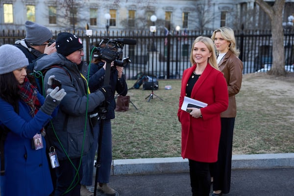 White House press secretary Karoline Leavitt, second right, speaks to reporters at the White House in Washington, Monday, March 3, 2025. (AP Photo/Ben Curtis)