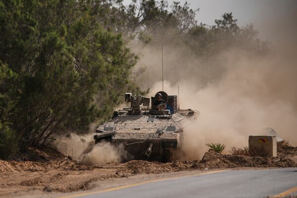 Israeli forces move along the border with the Gaza Strip, in southern Israel, Monday, May 19, 2025. (AP Photo/Ohad Zwigenberg)