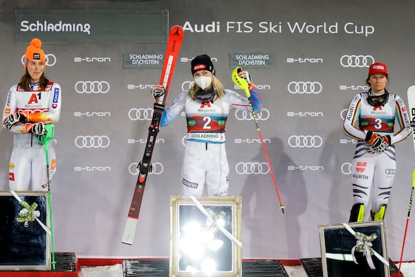 FILE - United States' Mikaela Shiffrin, center, winner of an alpine ski women's World Cup slalom, poses with second placed Slovakia's Petra Vlhova, left, and third placed Germany's Lena Duerr, in Schladming, Austria, Tuesday, Jan. 11, 2022. (AP Photo/Giovanni Maria Pizzato, File)