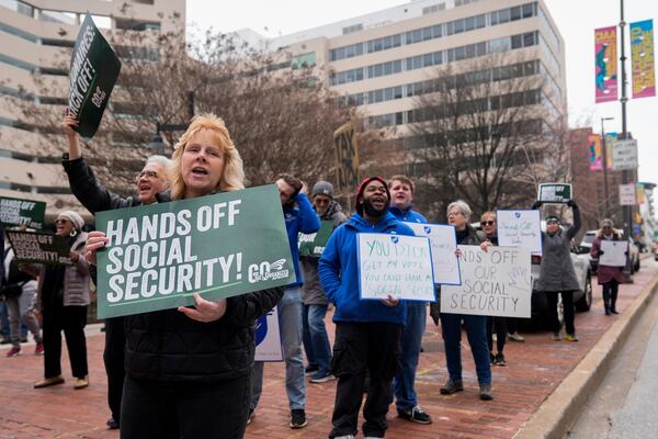 Demonstrators gather outside of the Edward A. Garmatz United States District Courthouse in Baltimore, on Friday, March 14, 2025, before a hearing regarding the Department of Government Efficiency's access to Social Security data. (AP Photo/Stephanie Scarbrough)