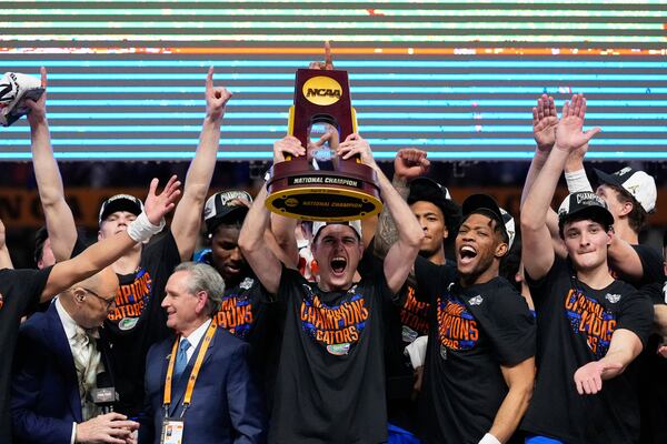 Florida celebrates with the trophy after their win against the Houston in the national championship at the Final Four of the NCAA college basketball tournament, Monday, April 7, 2025, in San Antonio. (AP Photo/Brynn Anderson)