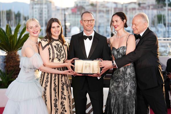 Director Joachim Trier, centre, winner of the grand prix for the film 'Sentimental Value', poses with Elle Fanning, from left, Inga Ibsdotter Lilleaas, Renate Reinsve and Stellan Skarsgard at the awards ceremony photo call at the 78th international film festival, Cannes, southern France, Saturday, May 24, 2025. (Photo by Scott A Garfitt/Invision/AP)