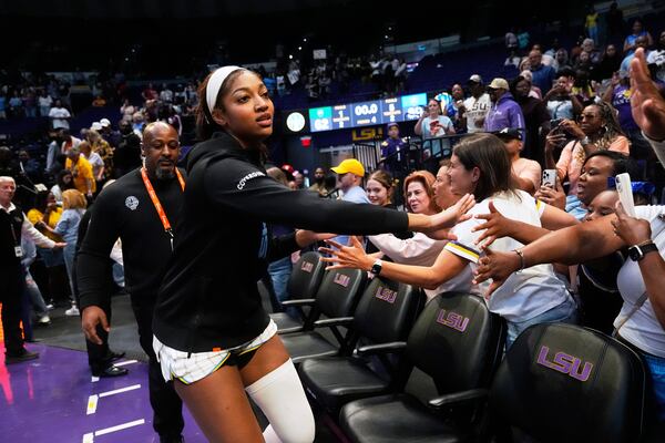 Chicago Sky forward Angel Reese greets the crowd after a WNBA exhibition basketball game against Brazil in Baton Rouge, La., Friday, May 2, 2025. (AP Photo/Gerald Herbert)