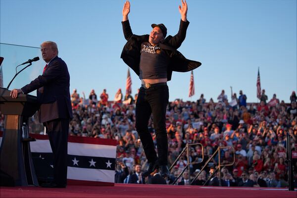 FILE - Elon Musk jumps on the stage as Republican presidential nominee former President Donald Trump speaks at the Butler Farm Show on Oct. 5, 2024, in Butler, Pa. (AP Photo/Evan Vucci, File)