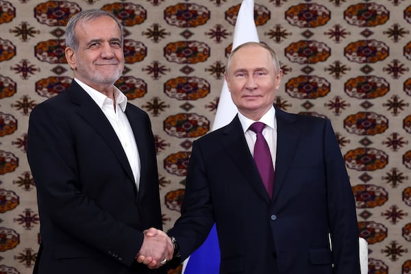 FILE - Russian President Vladimir Putin, right, and Iranian President Masoud Pezeshkian pose for a photo at their meeting in Ashgabat, Turkmenistan, on Oct. 11, 2024. (Alexander Shcherbak, Sputnik, Kremlin via AP, File)