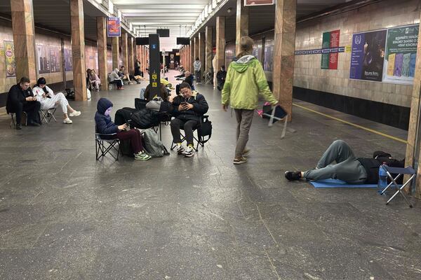 People take shelter at Kontraktova Ploshcha subway station during a Russian drone and missile attack in Kyiv, Ukraine, Saturday, May 24, 2025. (AP Photo/Illia Novikov)
