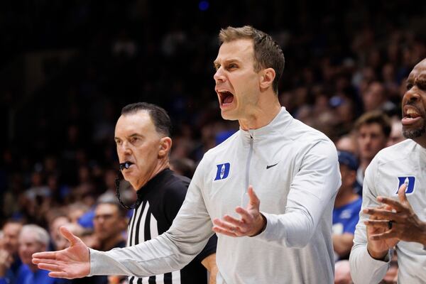 Duke head coach Jon Scheyer, center, reacts after a play during the first half of an NCAA college basketball game against Wake Forest in Durham, N.C., Monday, March 3, 2025. (AP Photo/Ben McKeown)