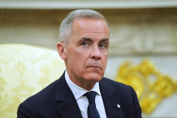 Canadian Prime Minister Mark Carney listtens to questions during a meeting with President Donald Trump in the Oval Office of the White House, Tuesday, May 6, 2025, in Washington. (AP Photo/Evan Vucci)