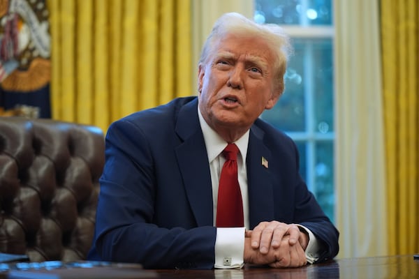 President Donald Trump speaks as he signs executive orders in the Oval Office at the White House, Thursday, Jan. 30, 2025, in Washington. (AP Photo/Evan Vucci)