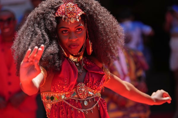 A dancer performs during the ceremony that officially kicks off Carnival in Rio de Janeiro, Brazil, Friday, Feb. 28, 2025. (AP Photo/Silvia Izquierdo)