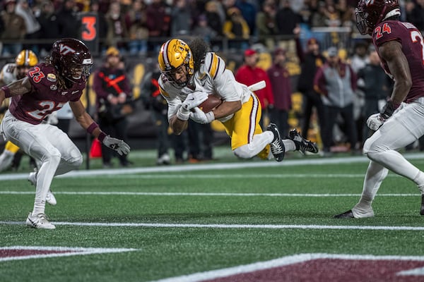 Minnesota wide receiver Elijah Spencer (11) dives in for a touchdown during the first half of the Duke's Mayo Bowl NCAA college football game Friday, Jan. 3, 2025, in Charlotte, N.C.(AP Photo/Robert Simmons)