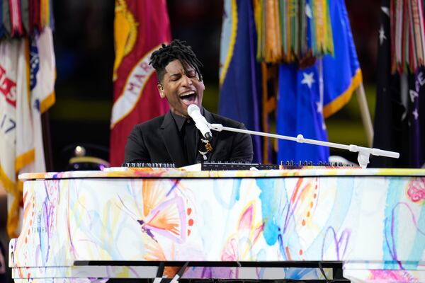 Jon Batiste performs the national anthem before the NFL Super Bowl 59 football game between the Kansas City Chiefs and the Philadelphia Eagles, Sunday, Feb. 9, 2025, in New Orleans. (AP Photo/George Walker IV)