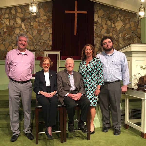 This photo provided by AP reporter Paul Newberry shows Newberry, his wife Linda and son Hudson with Rosalynn and Jimmy Carter in the Maranatha Baptist Church in Plains, Ga., March 27, 2016. (Paul Newberry via AP)