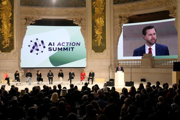 European Commission President Ursula von der Leyen, left, listens as United States Vice-President JD Vance addresses the audience at the Grand Palais during the Artificial Intelligence Action Summit in Paris, Tuesday, Feb. 11, 2025. (AP Photo/Michel Euler)