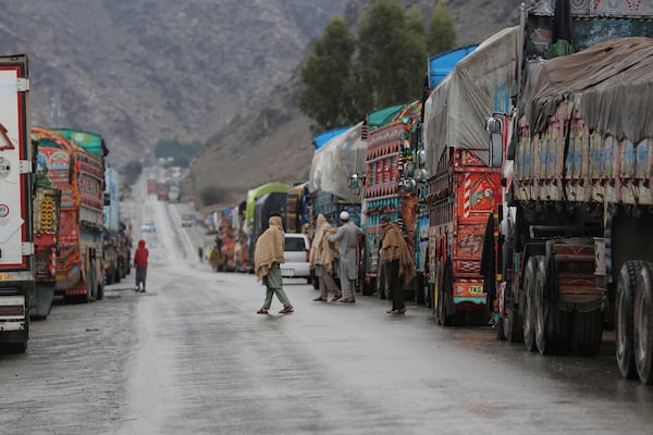 Trucks wait to cross the closed Torkham border with Pakistan, where Pakistani and Afghan forces exchanged fire overnight, in Torkham, Afghanistan, Monday, March 3, 2025.(AP Photo/Shafiullah Kakar)