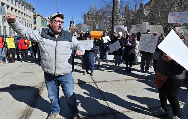 Patrick Festa chants in support of the National Park Service at a "Save Steamtown" rally to protest the Trump administration layoffs at the Steamtown National Historic Site in Scranton, Pa., Saturday, Feb. 22, 2025. (Aimee Dilger/WVIA via AP)