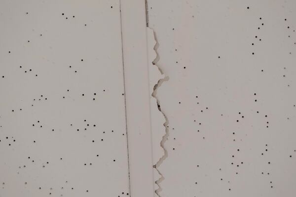 Cracks are seen in a ceiling at Smith Tower Apartments on Monday, March 10, 2025, in Vancouver, Wash. (AP Photo/Jenny Kane)