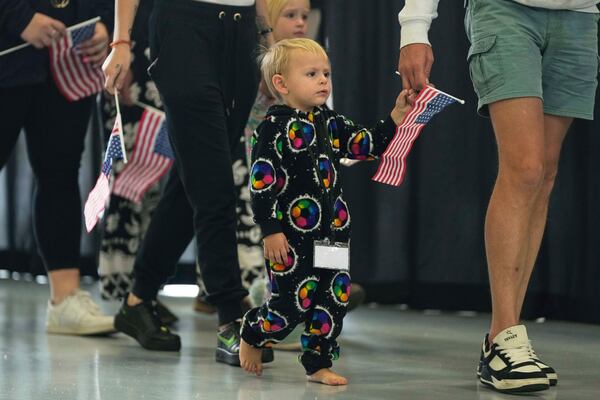 Afrikaner refugees from South Africa arrive, Monday, May 12, 2025, at Dulles International Airport in Dulles, Va. (AP Photo/Julia Demaree Nikhinson)