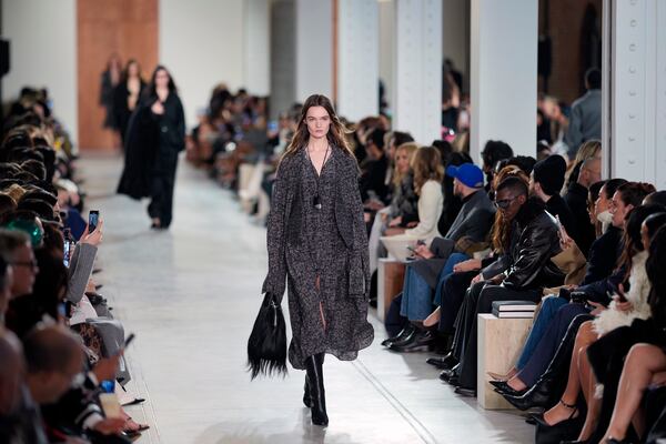 Models walk the runway during the Michael Kors Fall/Winter 2025 fashion show as part of New York Fashion Week on Tuesday, Feb. 11, 2025, at Terminal Warehouse in New York. (Photo by Charles Sykes/Invision/AP)