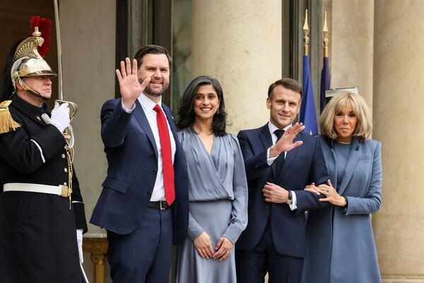 French President Emmanuel Macron, second right, and Brigitte Macron, right, pose for a group photo with United States Vice-President JD Vance and second lady Usha Vance during arrivals for a working lunch at the Elysee Palace during an event on the sidelines of the Artificial Intelligence Action Summit in Paris, Tuesday, Feb. 11, 2025. (AP Photo/Thomas Padilla)