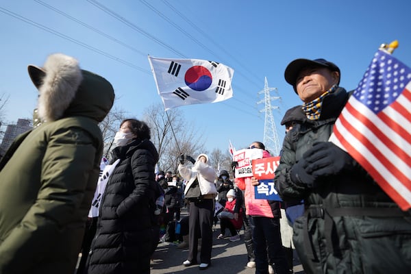 Supporters of impeached South Korean President Yoon Suk Yeol attend a rally to oppose his impeachment outside of a detention center in Uiwang, South Korea, Friday, Jan. 17, 2025. (AP Photo/Lee Jin-man)