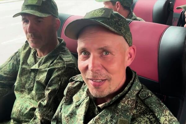 In this photo, taken from a video released by Russian Defense Ministry press service, Russian servicemen sit in a bus after returning from captivity after an exchange between Russia and Ukraine, at an undisclosed location in Belarus, Saturday, May 24, 2025. (Russian Defense Ministry Press Service via AP)