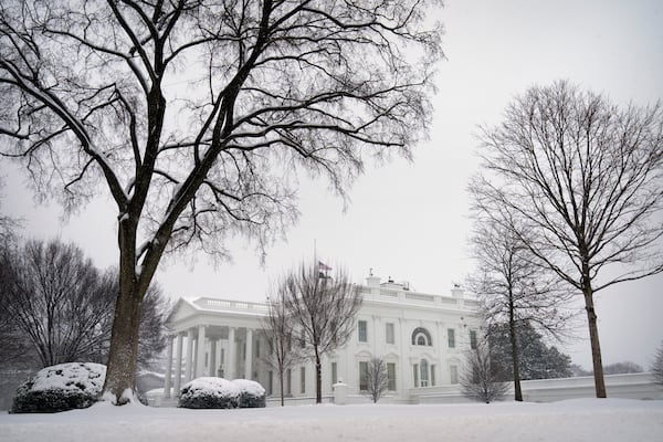 Snow falls during a winter storm at the White House, Monday, Jan. 6, 2025, in Washington. (AP Photo/Mark Schiefelbein)