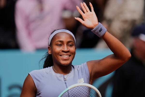 United States' Coco Gauff celebrates after her victory over Mirra Andreeva of Russia at the Madrid Open quarter-final tennis match in Madrid, Spain, Wednesday, April 30, 2025. (AP Photo/Manu Fernandez)