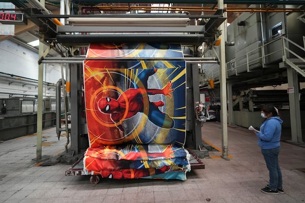 An employee works at a textile factory in Tlaxcala, Mexico, Tuesday, Feb. 4, 2025. (AP Photo/Eduardo Verdugo)