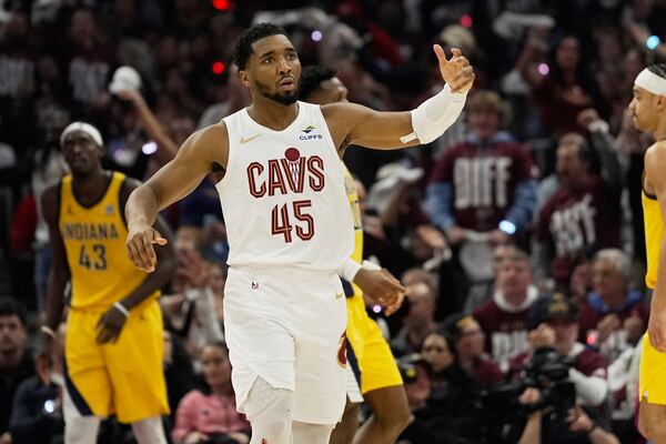 Cleveland Cavaliers guard Donovan Mitchell (45) gestures to the crowd during Game 1 in the Eastern Conference semifinals of the NBA basketball playoffs against the Indiana Pacers Sunday, May 4, 2025, in Cleveland. (AP Photo/Sue Ogrocki)