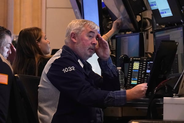 Traders work on the floor of the New York Stock Exchange, Tuesday, March 11, 2025. (AP Photo/Richard Drew)