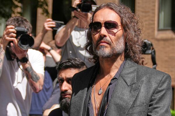 English comedian and actor Russell Brand leaves Southwark Crown Court where he is charged with rape and sexual assault in London, Friday, May 30, 2025.(AP Photo/Alastair Grant)