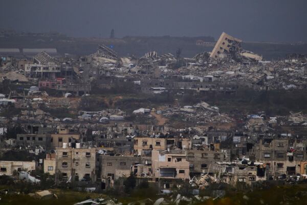 Buildings destroyed during the Israeli air and ground offensive in the Gaza Strip as seen from southern Israel, Thursday, March 20, 2025. (AP Photo/Leo Correa)