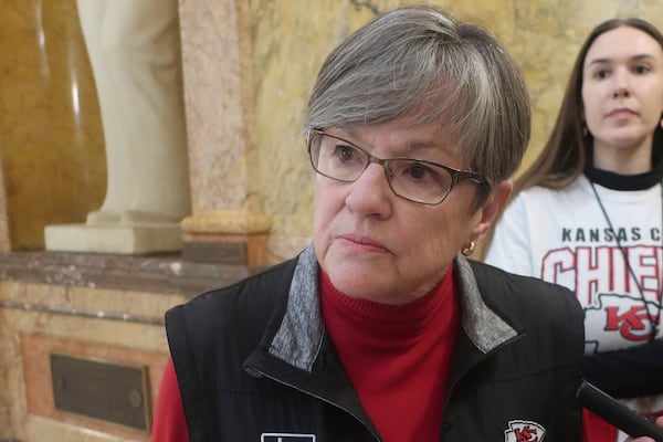 Kansas Gov. Laura Kelly speaks to reporters following a public event, Friday, Feb. 7, 2025, at the Statehouse in Topeka, Kansas. She has vetoed a bill that would ban gender-affirming care for transgender minors. (AP Photo/John Hanna)