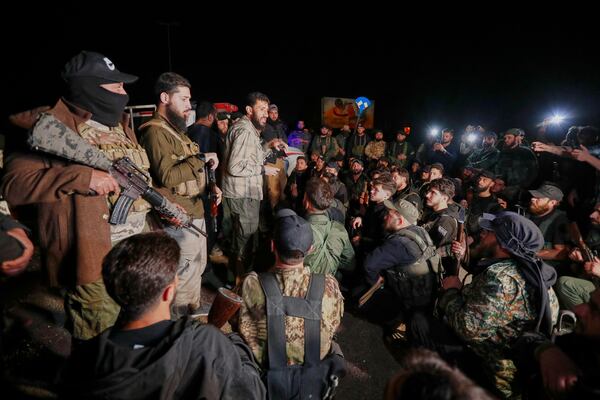 Syria's security forces gather, after reaching a deal with Druze gunmen to deploy around Jaramana, a Damascus suburb that saw fighting earlier this week, in Damascus, Syria, early Friday, May 2, 2025. (AP Photo/Omar Sanadiki)