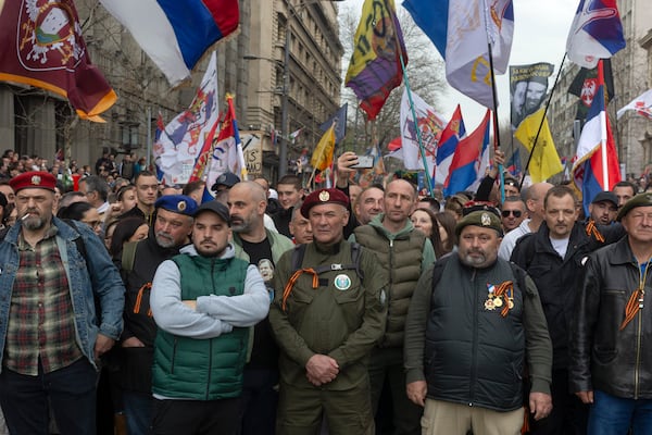 Serbian army veterans are seen during a major anti-corruption rally led by university students in Belgrade, Serbia, Saturday, March 15, 2025. (AP Photo/Marko Drobnjakovic)