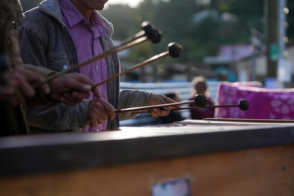 Marimba musicians play at a religious procession honoring the Black Christ of Esquipulas the day before its feast day in Esquipulas Palo Gordo, in Guatemala's San Marcos department, Tuesday, Jan. 14, 2025. (AP Photo/Moises Castillo)