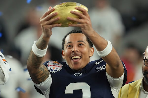 Penn State cornerback Jalen Kimber (3) celebrates after the Fiesta Bowl College Football Playoff game against Boise State, Tuesday, Dec. 31, 2024, in Glendale, Ariz. (AP Photo/Ross D. Franklin)