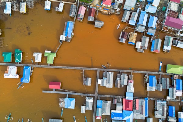 Murky brown water is visible near nickel mining activities that surround Baliara village on Kabaena Island, Southeast Sulawesi, Friday, Nov. 15, 2024. (AP Photo/Yusuf Wahid)