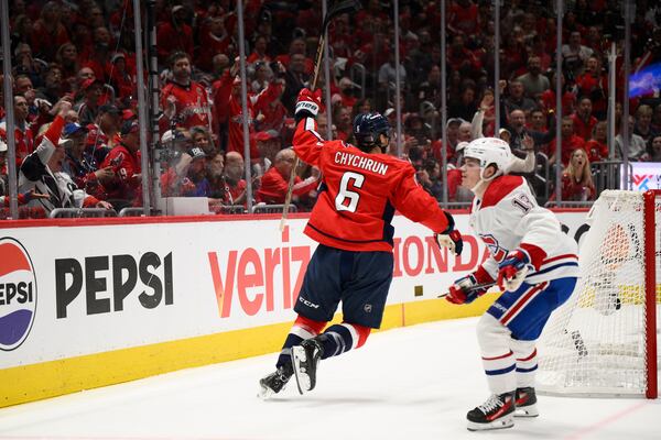 Washington Capitals defenseman Jakob Chychrun (6) celebrates his goal past Montreal Canadiens right wing Cole Caufield (13) in the first period of Game 5 of a first-round NHL hockey playoff series Wednesday, April 30, 2025, in Washington. (AP Photo/Nick Wass)