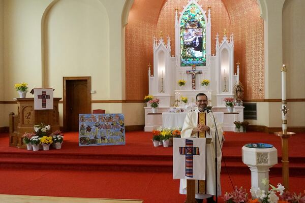 The Rev. Hierald Osorto speaks to the congregation of St. Paul’s-San Pablo Lutheran Church, which holds wellness sessions after Sunday worship in the sanctuary as part of its migrant ministry, in Minneapolis, Sunday, April 27, 2025. (AP Photo/Giovanna Dell’Orto)