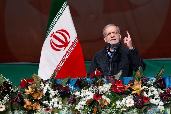 In this photo released by the Iranian Presidency Office, President Masoud Pezeshkian speaks during a rally commemorating anniversary of 1979 Islamic Revolution that toppled the late pro-U.S. Shah Mohammad Reza Pahlavi and brought Islamic clerics to power, in Tehran, Iran, Monday, Feb. 10, 2025. (Iranian Presidency Office via AP)