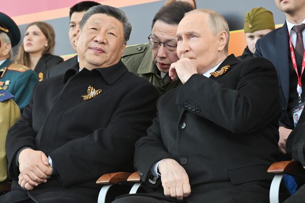 Russian President Vladimir Putin, right, and Chinese President Xi Jinpin watch the Victory Day military parade in Moscow, Russia, Friday, May 9, 2025, during celebrations of the 80th anniversary of the Soviet Union's victory over Nazi Germany during the World War II. (Mikhail Korytov/Photo host agency RIA Novosti via AP)