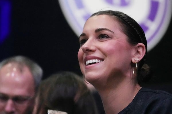 Former U.S. women's national soccer team player Alex Morgan watches the inaugural Unrivaled 3-on-3 basketball game between the Lunar Owls and the Mist, Friday, Jan. 17, 2025, in Medley, Fla. (AP Photo/Marta Lavandier)