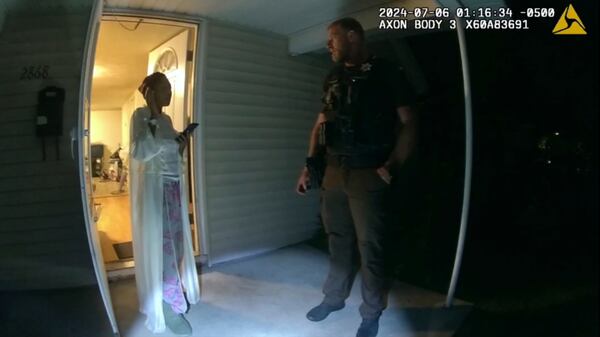 FILE - In this image taken from body camera video released by Illinois State Police, Sonya Massey, left, talks with former Sangamon County Sheriff's Deputy Sean Grayson outside her home in Springfield, Ill., July 6, 2024. (Illinois State Police via AP, File)