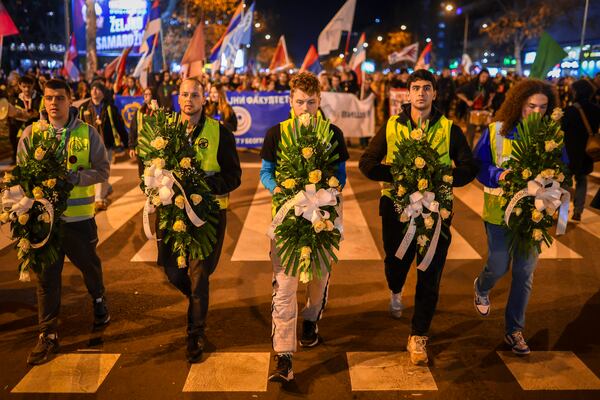 Youngsters carry wreaths with the names of victims during a protest over the collapse of a concrete canopy that killed 15 people more than two months ago, in Novi Sad, Serbia, Friday, Jan. 31, 2025. (AP Photo/Armin Durgut)