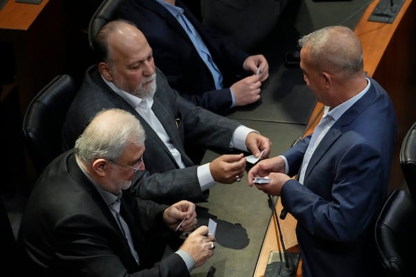 Hezbollah's parliamentary bloc members attend a parliamentary session to elect a new president, at the parliament building in downtown Beirut, Lebanon, Thursday, Jan. 9, 2025. (AP Photo/Hussein Malla)