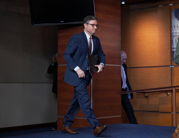 Speaker of the House Mike Johnson, R-La., arrives to talk to reporters after a closed-door meeting with fellow Republicans on a spending bill, at the Capitol in Washington, Tuesday, Feb. 11, 2025. The current stopgap measure lasts through March 14. After that, without congressional action, there would be a partial government shutdown. (AP Photo/J. Scott Applewhite)